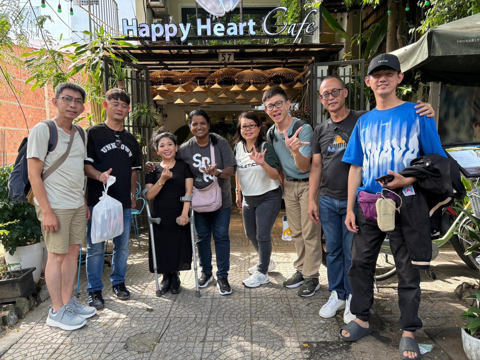 Guests outside the Happy Heart Cafe storefront